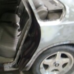 Before and after photographs of a damaged Chevy Impala that was repaired by Elite Paint & Body Shop in West Palm Beach, Florida.